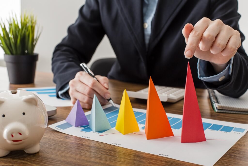 front view businessman with colorful cones representing growth